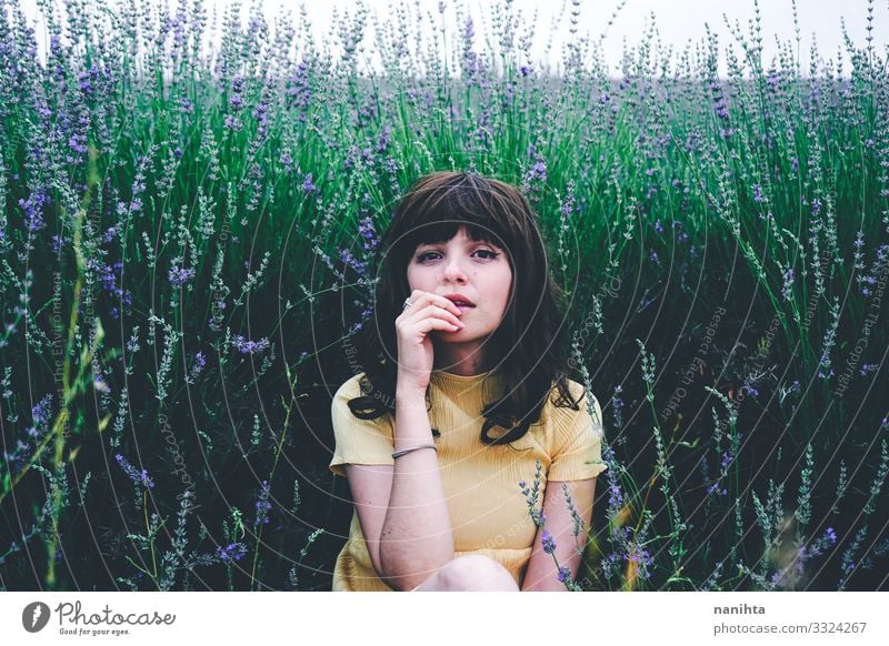 Young brunette woman sitting surrounded by lavender Lifestyle Beautiful Relaxation Calm Freedom Summer Human being Feminine Young woman Youth (Young adults)
