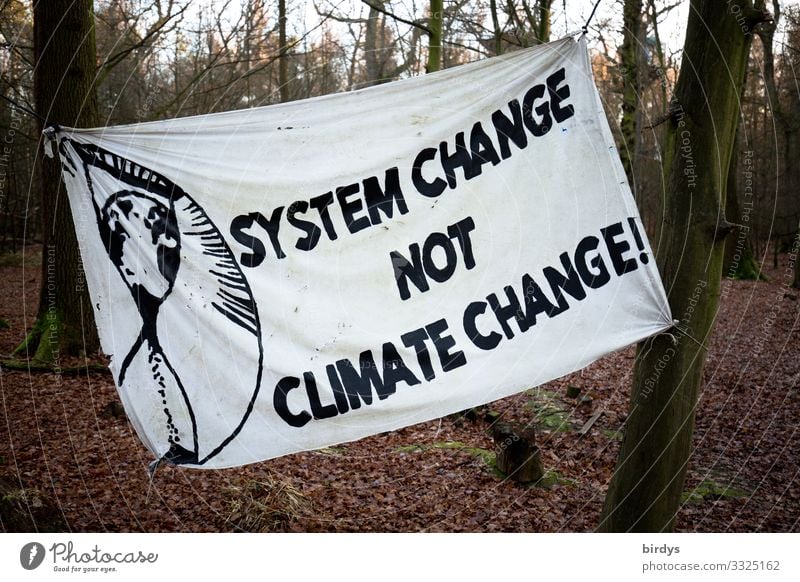System change not clima change, banner with the demand to change the political and economic system for the future. Climate change Climate Justice Forest