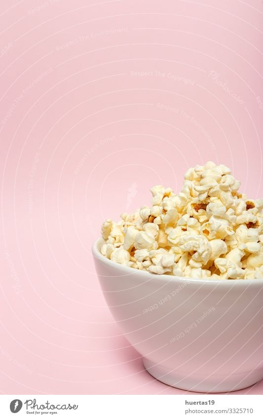 Popcorn on colored backgrounds Food Fast food Bowl Entertainment Cinema Fresh Delicious Pink White Colour Snack Salty movie Classic full pop Tasty isolated