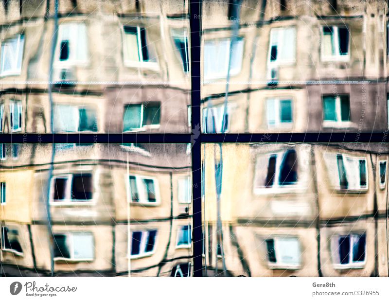 crooked reflection of houses in a glass window House (Residential Structure) Building Architecture Street Line Old Blue Yellow Colour background blur bowed City