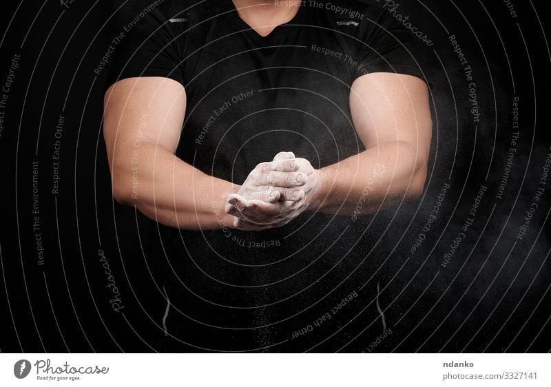 muscular athlete in a black uniform Lifestyle Body Fitness Sports Track and Field Human being Man Adults Hand Fingers Athletic Muscular Strong Black White Power
