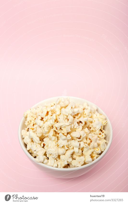 Popcorn on colored backgrounds Food Picnic Fast food Bowl Entertainment Cinema Fresh Delicious Pink White Colour Snack Salty movie Classic full pop Tasty