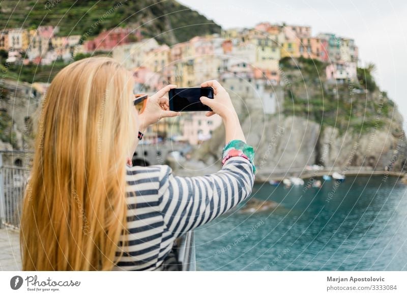 Young woman taking a photo of Cinque Terre Lifestyle Vacation & Travel Tourism Trip Sightseeing Cellphone Camera Technology Human being Feminine