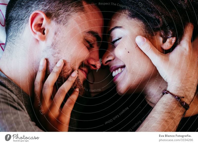happy couple in love at home. Afro american woman and caucasian man. ethnic love concept Couple Love African-American Ethnic Woman Home Bed Interior shot