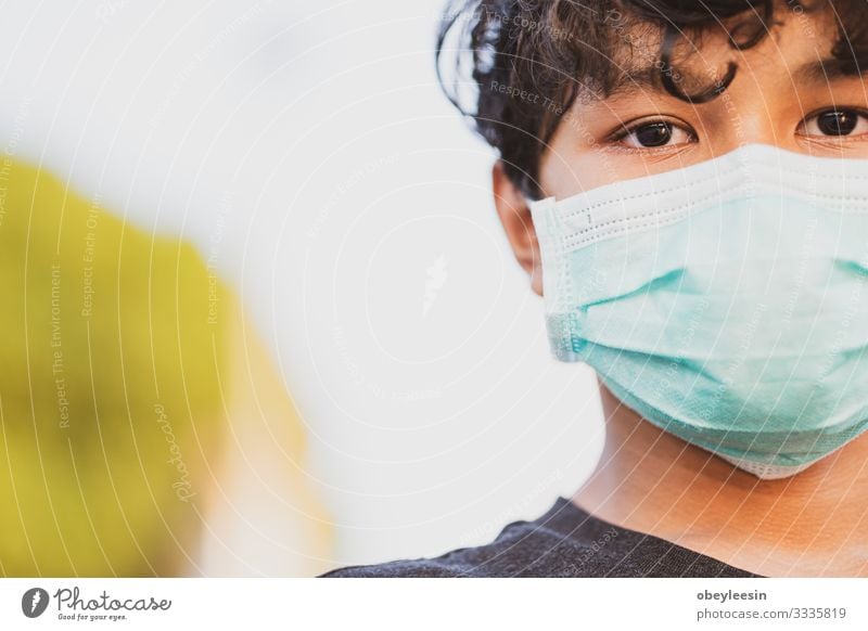 young asian boy wearing a protective mask Lifestyle Face Illness Vacation & Travel Human being Woman Adults Transport Street Protection Environmental pollution
