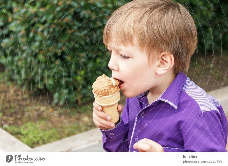 Blond boy are eating icecream with put out tongue Ice cream Eating Leisure and hobbies Child Schoolchild Human being Baby Boy (child) Man Adults Infancy Park