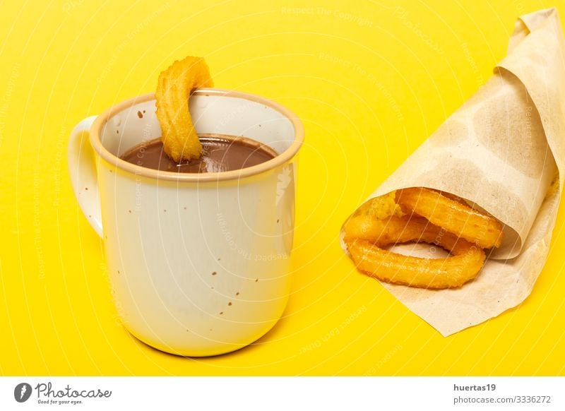 Cup of chocolate sauce with churros Food Dessert Breakfast Hot Chocolate Culture Yellow Tradition spanish Churros background cup Baked goods Frying Snack Spain