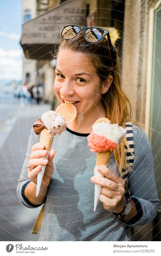 Young woman holding two ice creams in the street Ice cream Fast food Lifestyle Joy Vacation & Travel Tourism Trip Human being Feminine Youth (Young adults)