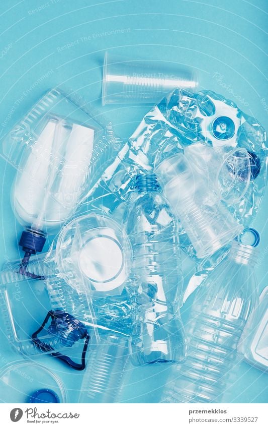 Squashed empty plastic waste collected to recycling Bottle Save Environment Container Packaging Package Plastic packaging Blue Environmental pollution