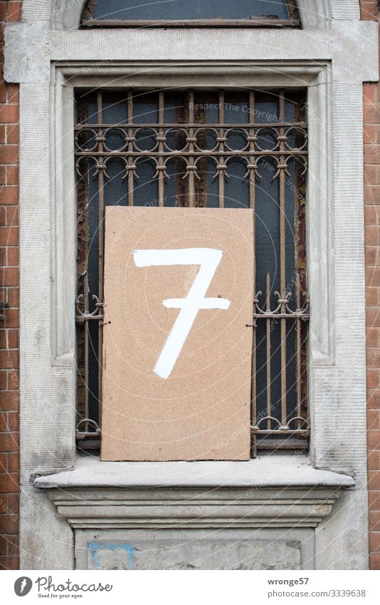 Input number 7 House (Residential Structure) Facade Window Digits and numbers Old Town Brown Gray White Living or residing Grating House number Old building