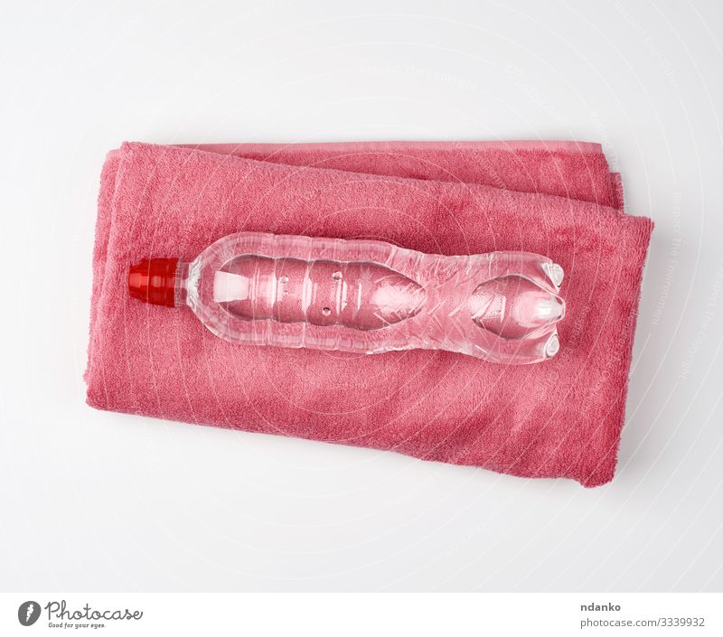 pink terry towel and a transparent bottle Beverage Bottle Health care Sports Container Plastic Fresh Clean Pink Red White Folded clear cold Conceptual design