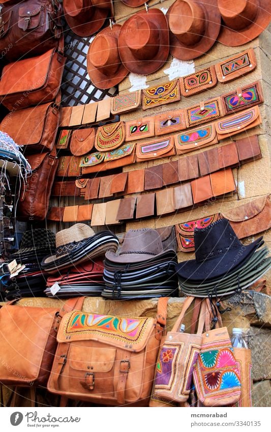 Diplay of Hats and Leather Purses Shopping Handicraft Marketplace Bag Sell Vertical Asia India Rajasthan Jaisalmer Patawon-ki-Haweli market retailing trade Sale