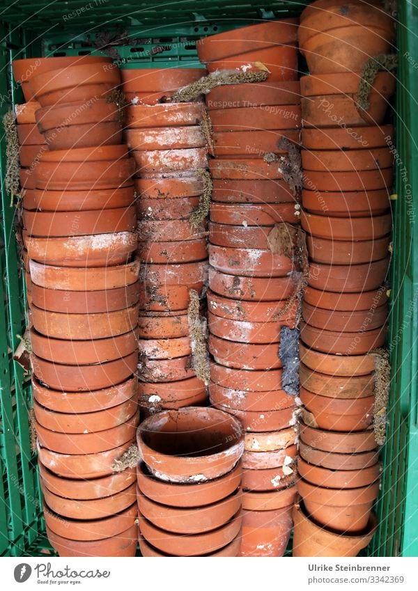 Discarded terracotta flower pots in stacks Flowerpot plant pot Terracotta shards Old Second-hand stacked Stack Crate quantity Winter activities clay pots