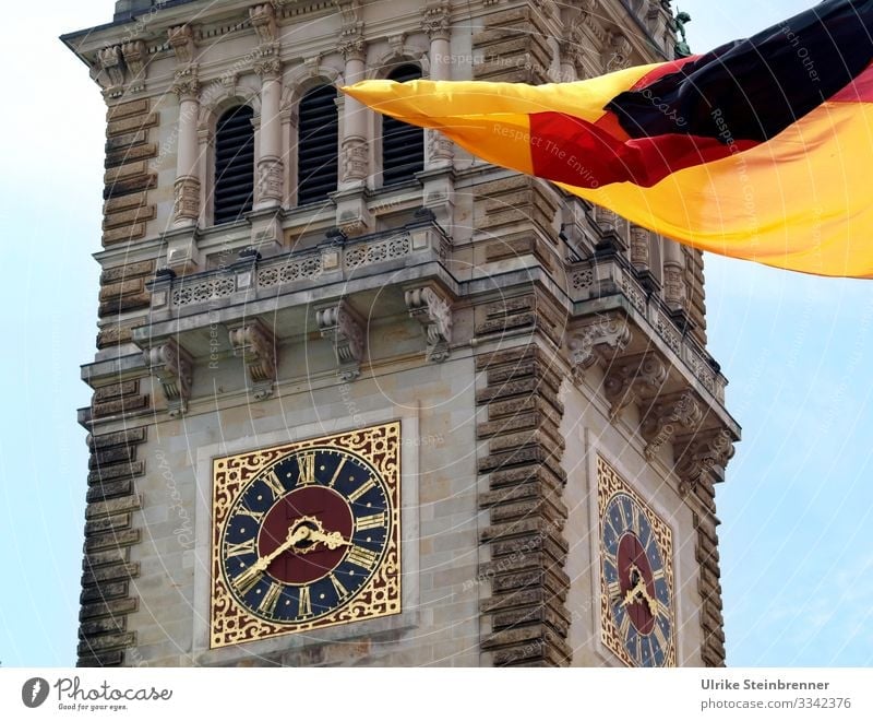 Clock at Hamburg City Hall with German flag Tourism Trip Sightseeing City trip Germany Europe Port City Downtown City hall Tower Manmade structures built