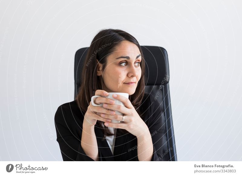beautiful young Business woman holding a cup of coffee. Business Concept. Lifestyle. Indoors Woman Computer Office Youth (Young adults) Notebook