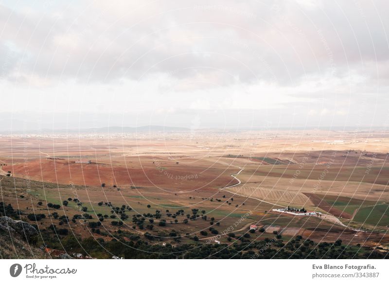 High view of a mosaic landscape on a cloudy day. Spain fields scenery Shadow Destination cloudscape Surface Aircraft Landscape Light Brown Clouds Earth cultured