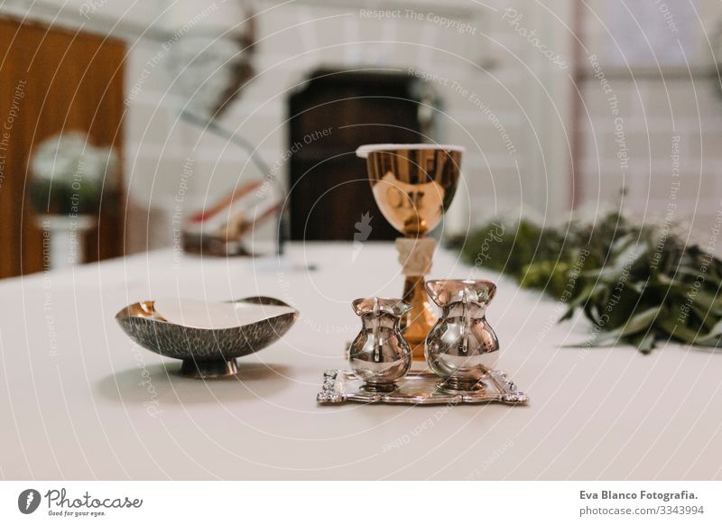goblet of wine on table during a wedding ceremony nuptial mass. Religion concept. Catholic eucharist ornaments for the celebration of the Eucharist Open Holy