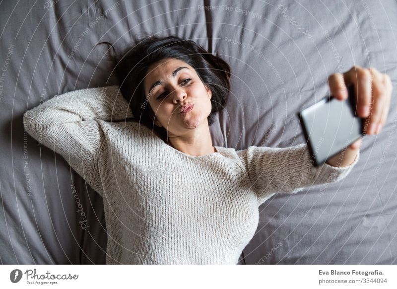 young woman taking a selfie on bed Youth (Young adults) Woman Coffee Lifestyle Easygoing Internet Business Interlaced Selfie Social Bed