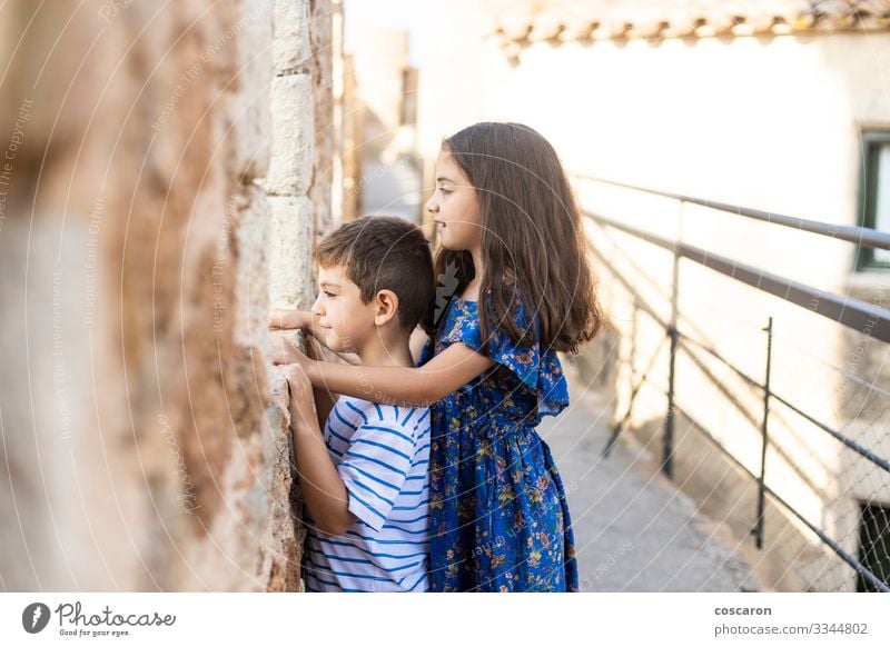 Two kids looking throw the wall of a castle Joy Happy Vacation & Travel Tourism Summer Summer vacation Child School Human being Masculine Feminine Toddler