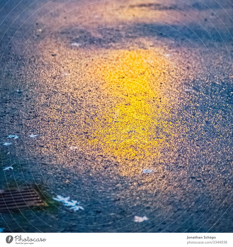 Reflection of a lantern on the asphalt Twilight conceit Street Asphalt Orange Yellow Wet Autumn evening mood Night mood