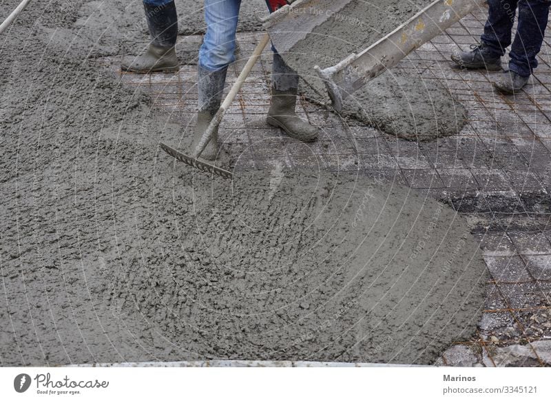 workers pouring wet concrete using concrete bucket. Work and employment Construction site Industry Business Building Street Concrete Steel Wet cement mix