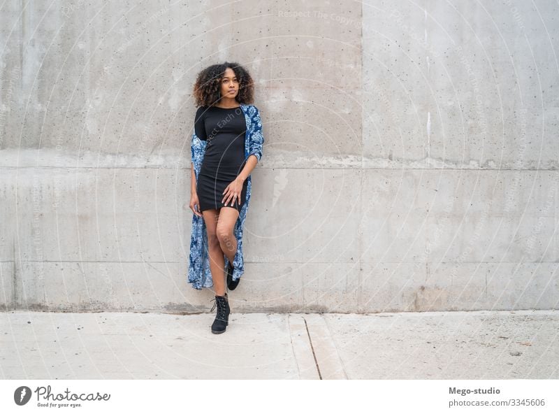 Afro-american woman against grey wall. Style Happy Beautiful Face Human being Feminine Woman Adults 1 18 - 30 years Youth (Young adults) Fashion Clothing