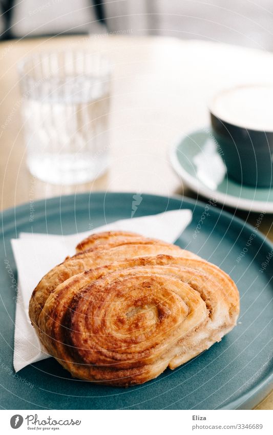 Delicious Franz roll Breakfast To have a coffee Coffee Café Dessert Baked goods French roll Sweet Candy Coffee break Table Tumbler Plate To enjoy Colour photo