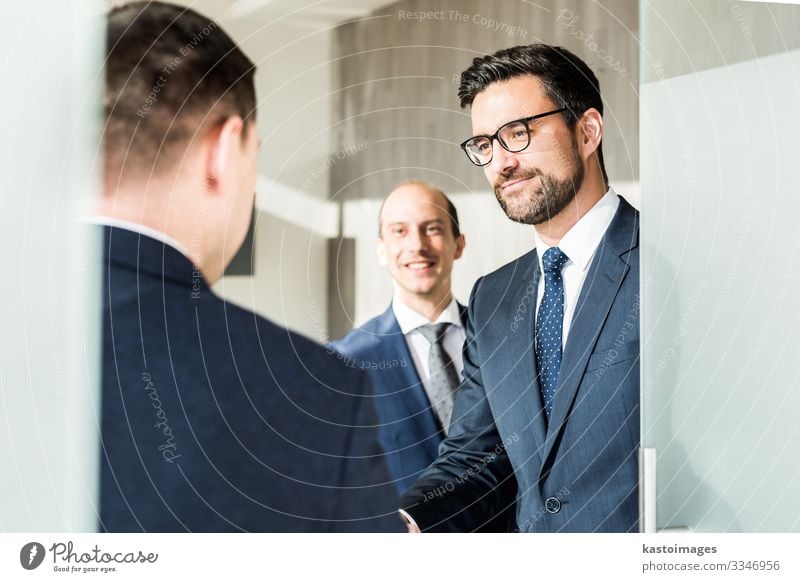 Business men greeting with handshake at business meeting. Lifestyle Elegant Happy Success Profession Financial Industry Company Meeting Human being Man Adults