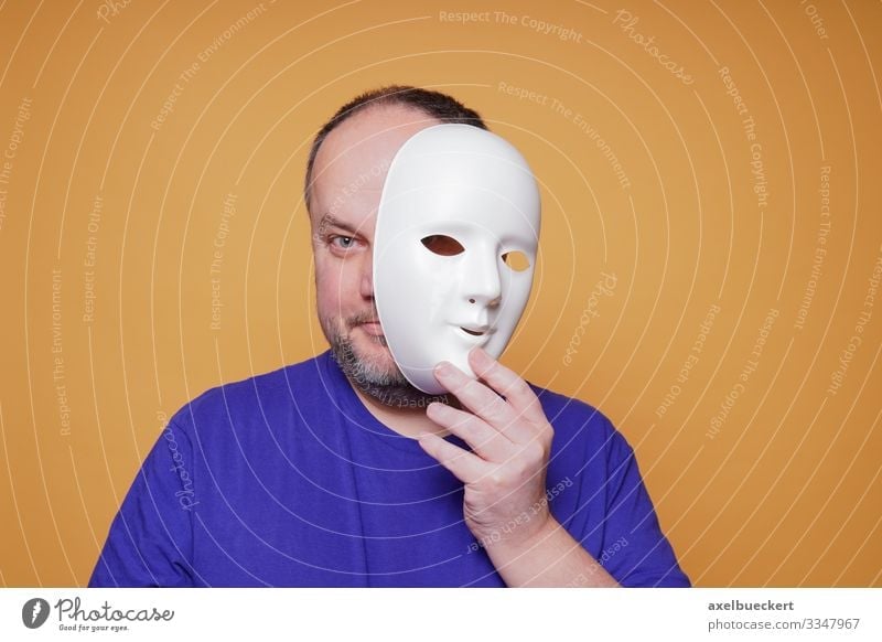 boom Vask vinduer vinde man taking off mask revealing face and identity - a Royalty Free Stock  Photo from Photocase