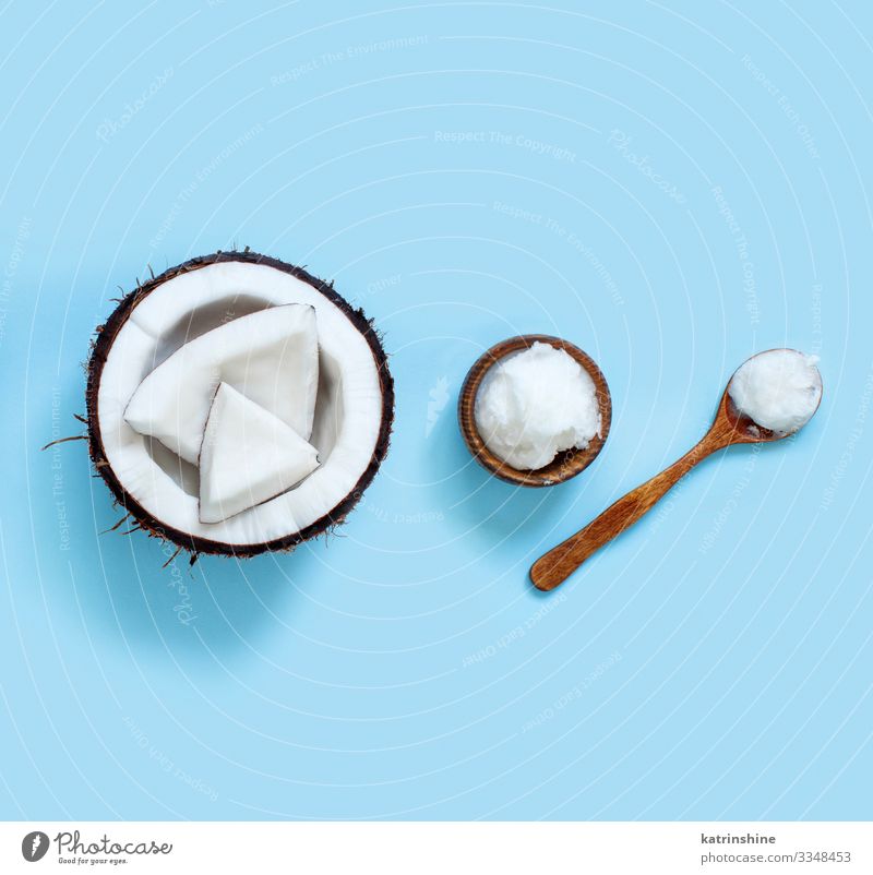 Coconut oil in a bowl with a spoon Vegetable Nutrition Vegetarian diet Diet Bowl Spoon Brown White keto Light blue bluecoconut oil Ingredients pieces Vegan diet