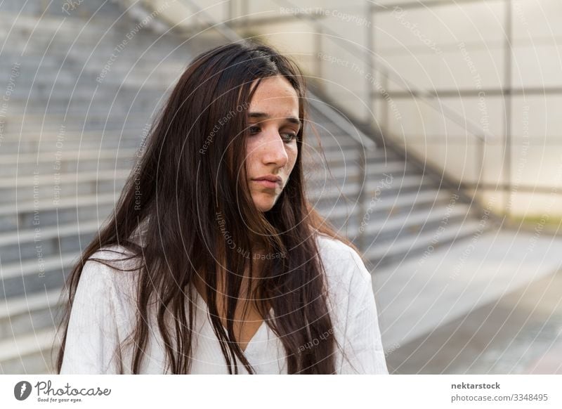 Young Woman with Forlorn Facial Expression Beautiful Face Adults Youth (Young adults) Stand Sadness Loneliness girl sad Facial expression urban beautiful woman