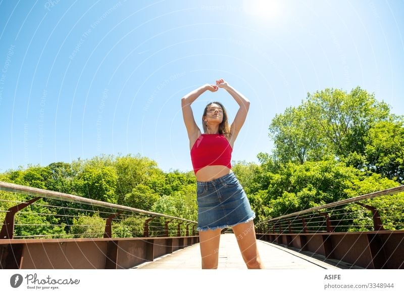 Young woman enjoying the sun and the nature Lifestyle Joy Happy Beautiful Relaxation Leisure and hobbies Summer Sun Woman Adults Youth (Young adults) Arm Nature