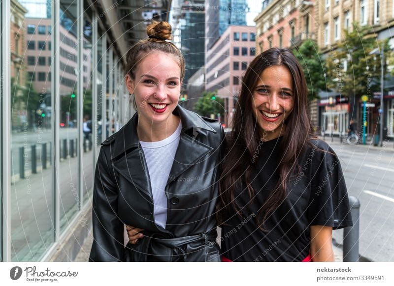 Portrait of Two Young Women Smiling Side by Side on City Street Lifestyle Beautiful Woman Adults Youth (Young adults) Happiness Joie de vivre (Vitality) Love