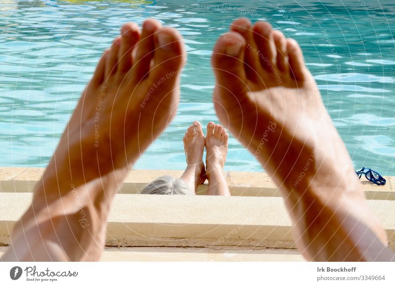 relaxed chilling at the pool with view through the feet Joy Swimming pool Vacation & Travel Tourism Summer vacation Sunbathing Couple Feet 2 Human being