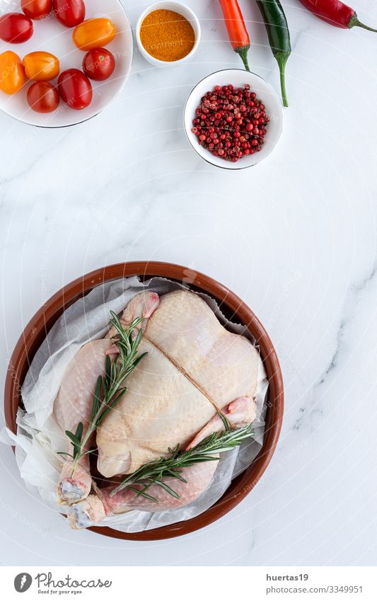 Whole uncooked chicken with herbs and spices Food Meat Vegetable Herbs and spices Nutrition Lunch Dinner Diet Bird Fresh Above Red White Chicken Raw cooking