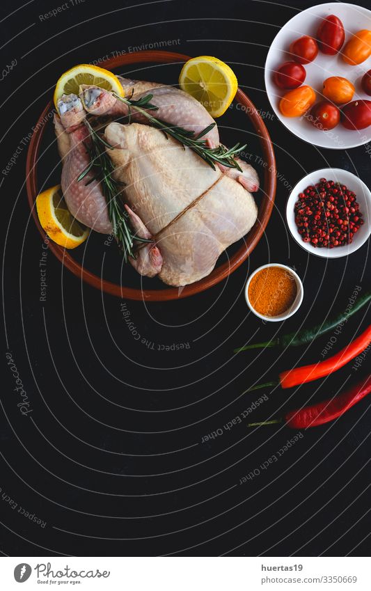 Whole uncooked chicken with herbs and spices Food Meat Vegetable Herbs and spices Nutrition Lunch Dinner Diet Bird Fresh Above Black Chicken Raw cooking