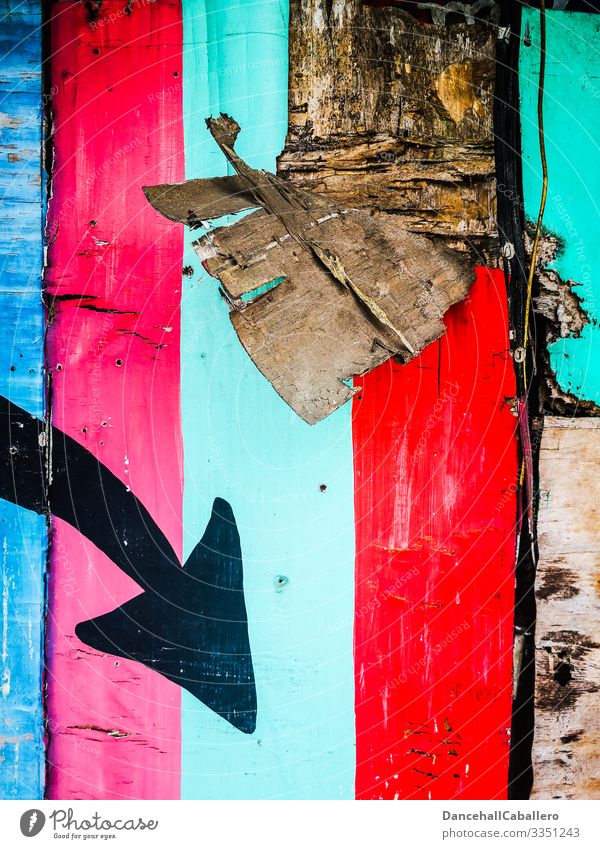colourful wooden wall with an arrow pointing down Arrow Direction Signs and labeling Road marking Navigation Orientation Clue Wall (building) Broken variegated