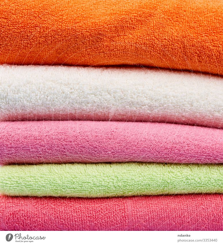 colored cotton terry folded towels Lifestyle Design Body Relaxation Spa Massage Fresh Modern New Clean Soft Green Pink Red White Colour textile Consistency