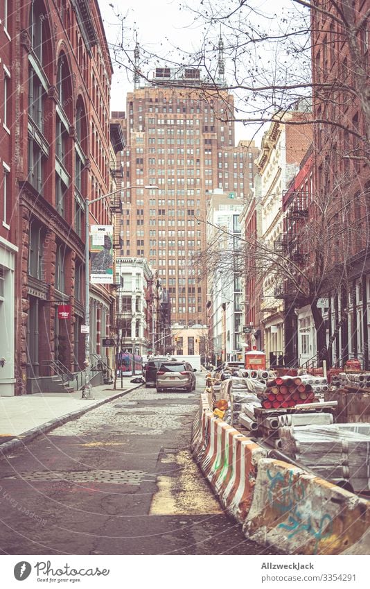 a side street filled with construction material in winter in new york New York City Side road Construction site building material USA Town High-rise Americas
