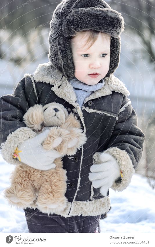 Baby in winter park Lifestyle Playing Winter vacation Child Boy (child) Brother Skin Head Face Eyes Nose Lips Chest Arm Fingers 1 Human being 1 - 3 years