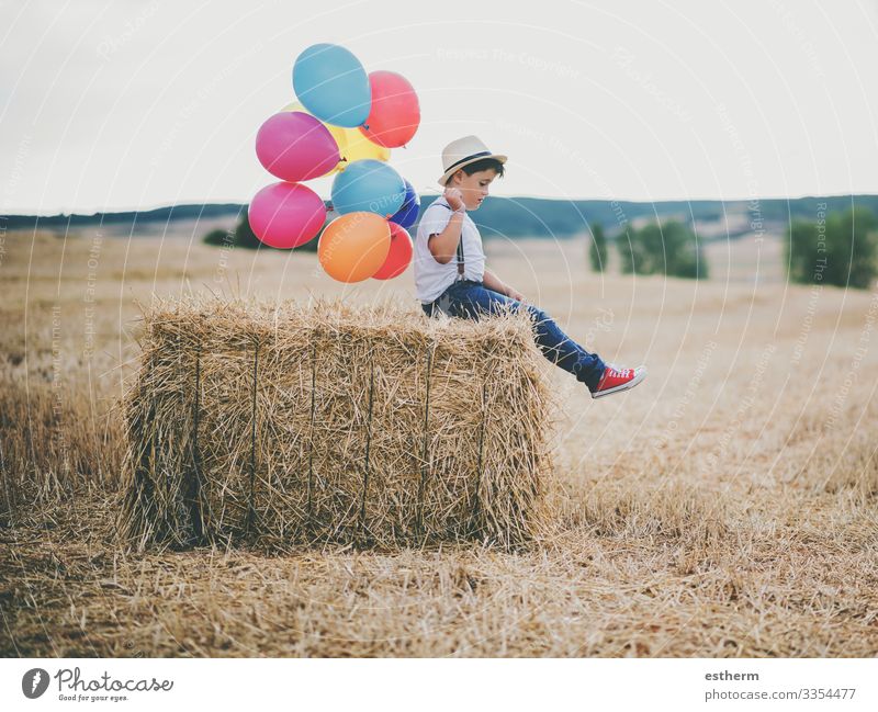 child with balloons in thein wheat field outdoor Lifestyle Relaxation Vacation & Travel Freedom Summer Human being Masculine Child Boy (child) 1 3 - 8 years
