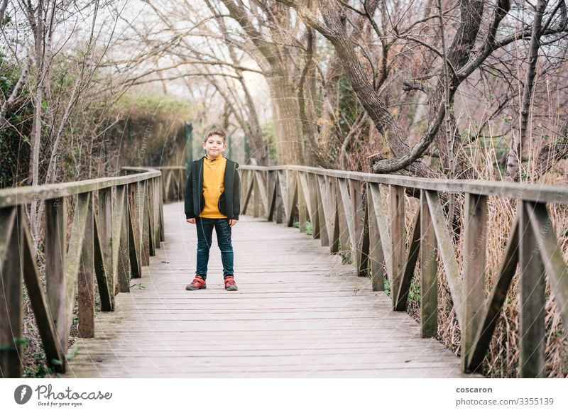 Lonely kid in the middle of a bridge Lifestyle Joy Happy Relaxation Leisure and hobbies Vacation & Travel Tourism Adventure Hiking Child Human being Masculine