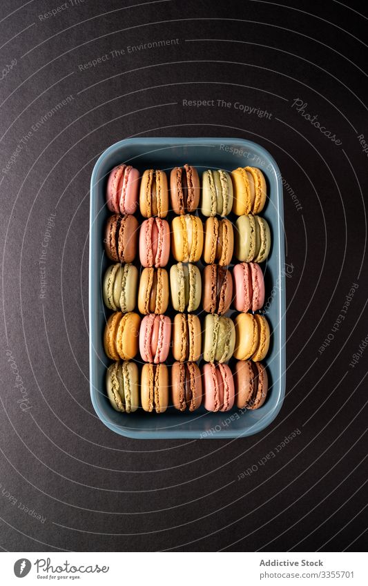 Fresh crunchy macaroons stack dessert container colorful snack food box biscuit sweet gourmet assorted pastry confection traditional delicious tasty yummy sugar