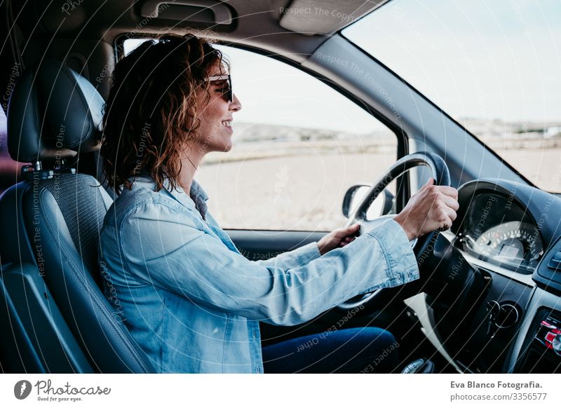 young beautiful woman driving a van. travel concept Woman Youth (Young adults) Driving Car Sunbeam Sunglasses Vacation & Travel Traveling Wheel Drive hire Share