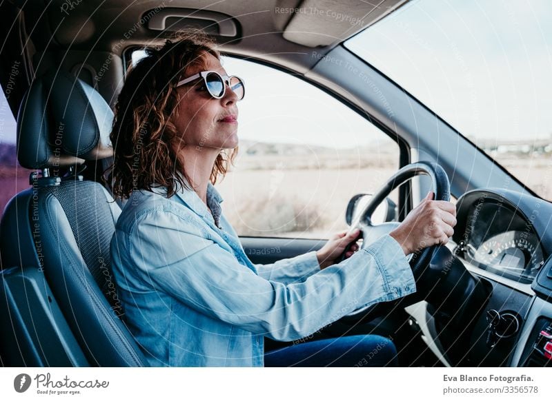 young beautiful woman driving a van. travel concept Woman Youth (Young adults) Driving Car Sunbeam Sunglasses Vacation & Travel Traveling Wheel Drive hire Share