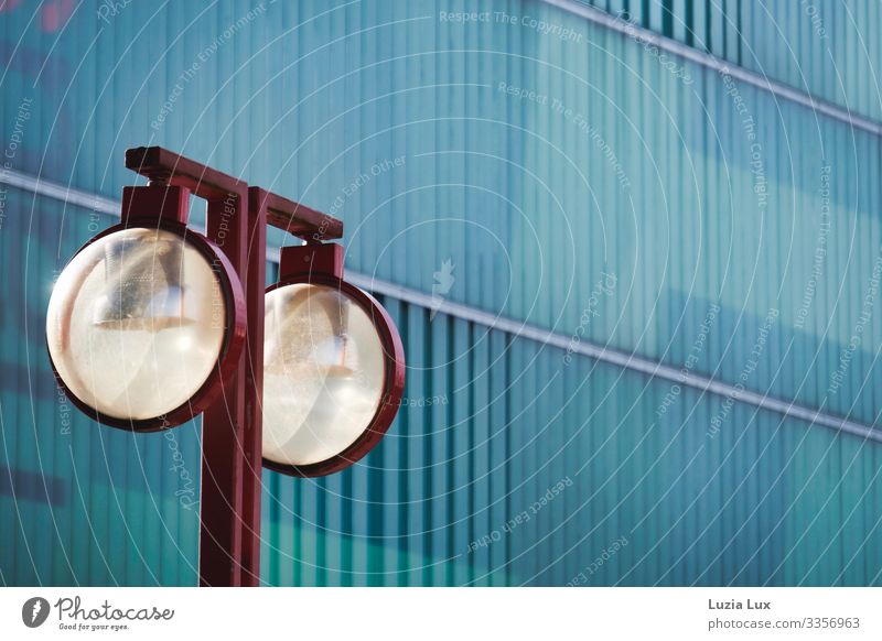 Red lamp Building Shopping malls Wall (barrier) Wall (building) Facade Lamp Street lighting Glass Metal Esthetic Blue Turquoise Colour photo Subdued colour