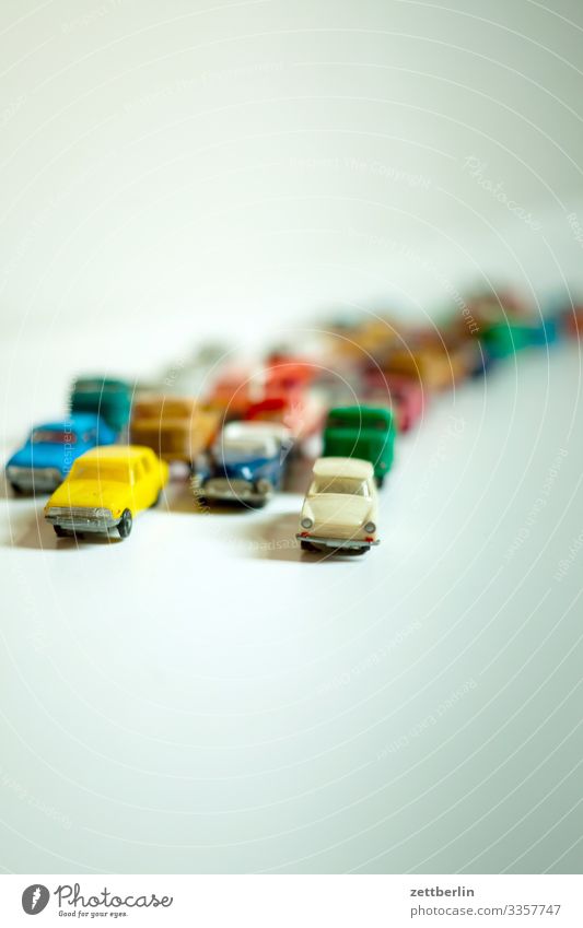 Toy jam again Car Driving Motor vehicle mass Crowd of people Replication Row Toys Tracks Traffic jam Stand Street Road traffic Speed Transport Many Full Crowded