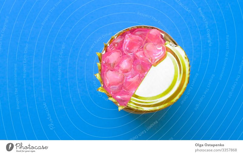 Pink hearts inside a tin can on blue color background Metal Steel Heart Love Blue Yellow White Safety Protection Romance Dependability Caution Thrifty