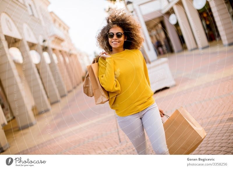 Young black woman with curly hair in shopping Lifestyle Shopping Style Happy Beautiful Hair and hairstyles Human being Young woman Youth (Young adults) Woman