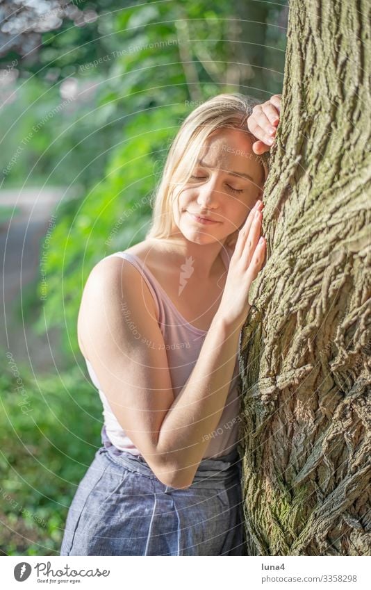 happy young woman hugs tree Woman Tree Embrace Stand relaxed Forest deceleration youthful Young woman left Relaxation time-out Meditative contented